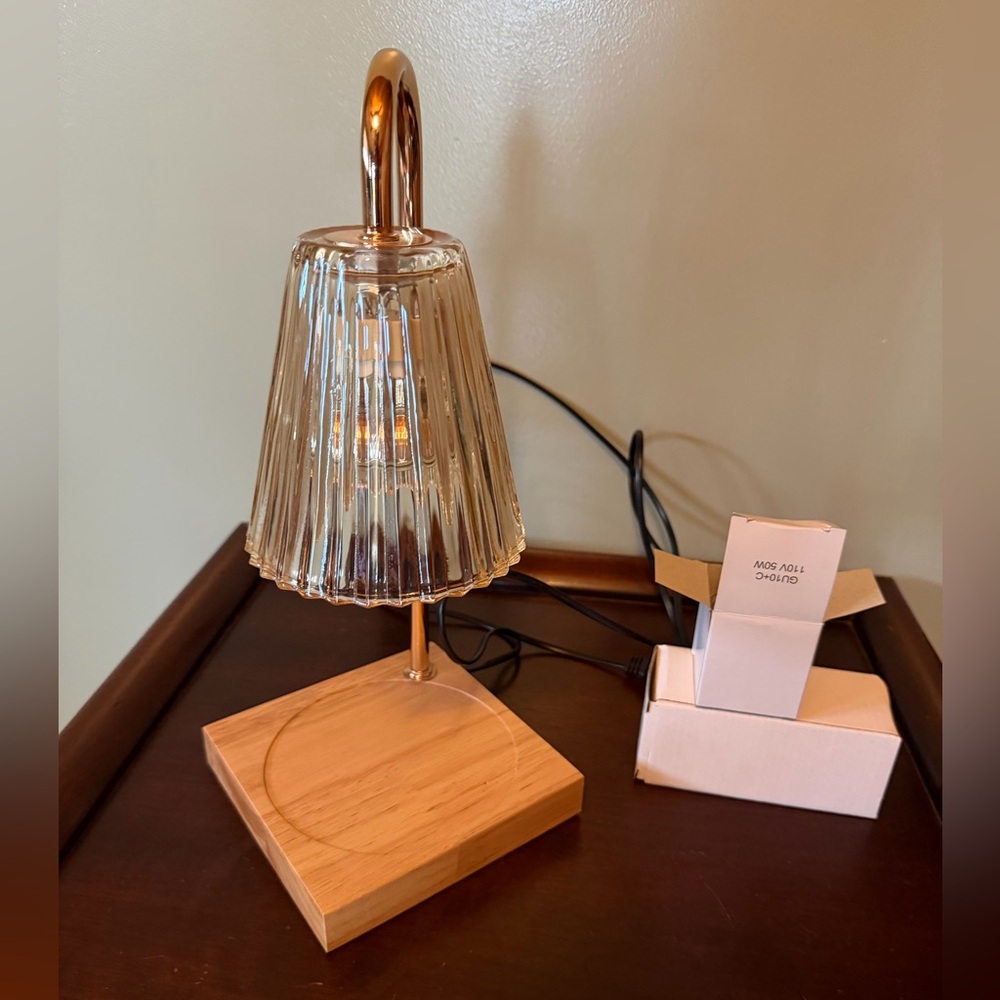 Candle warmer with glass shade with wooden base.
